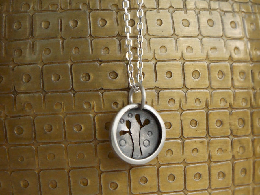 Tiny silver seedling necklace