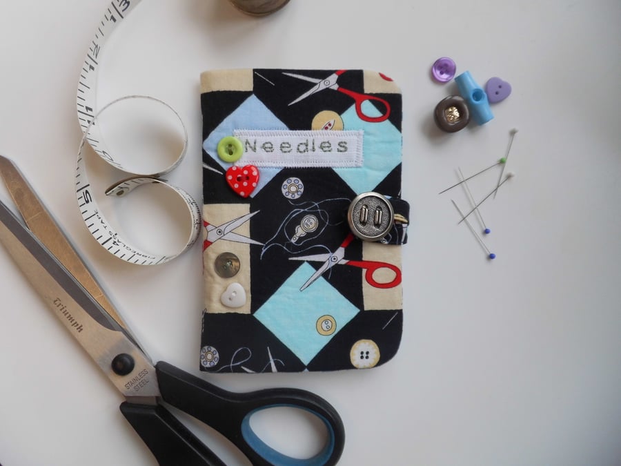 Sewing needle case in sewing-themed fabric