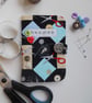 Sewing needle case in sewing-themed fabric - Image 1