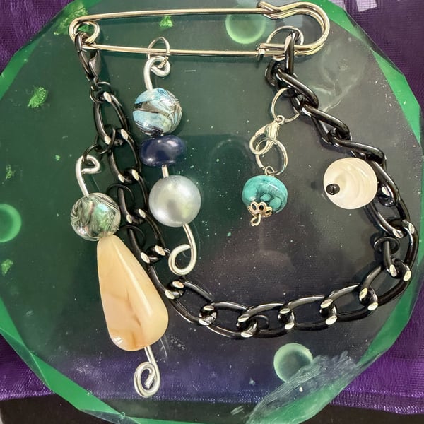 Unique pin brooch. Stylish, edgy, blue.