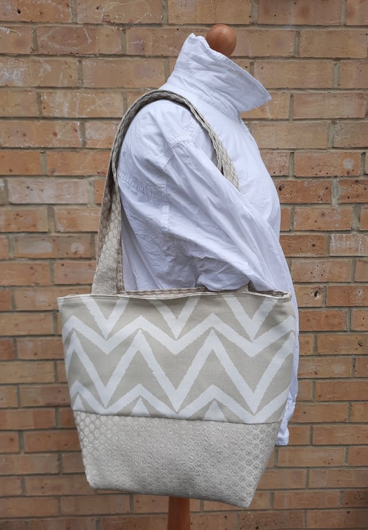 Large cream and white tote bag. 