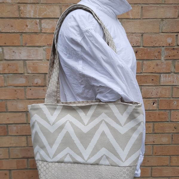 Large cream and white tote bag. 