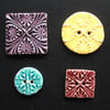 Set of four patterned ceramic buttons 