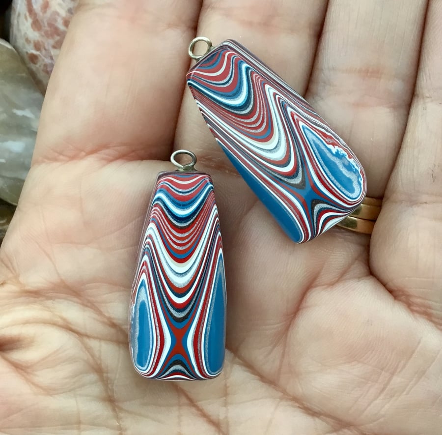 A matched pair of Dagenham Fordite Cabachons for jewellery projects.