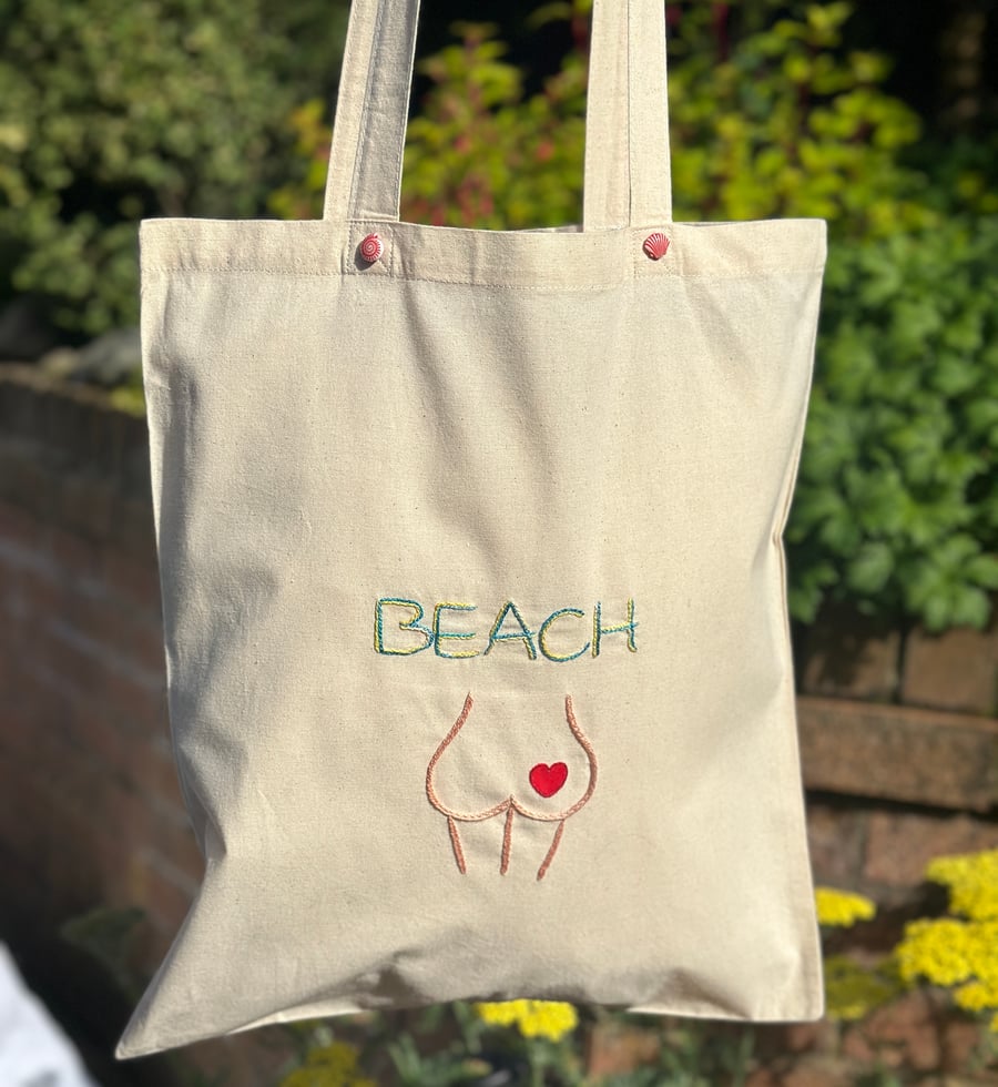Canvas tote bag with a cheeky beach bum, heart design.Summer holiday beach bag