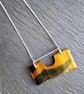 Tiger eye pendant on silver chain.