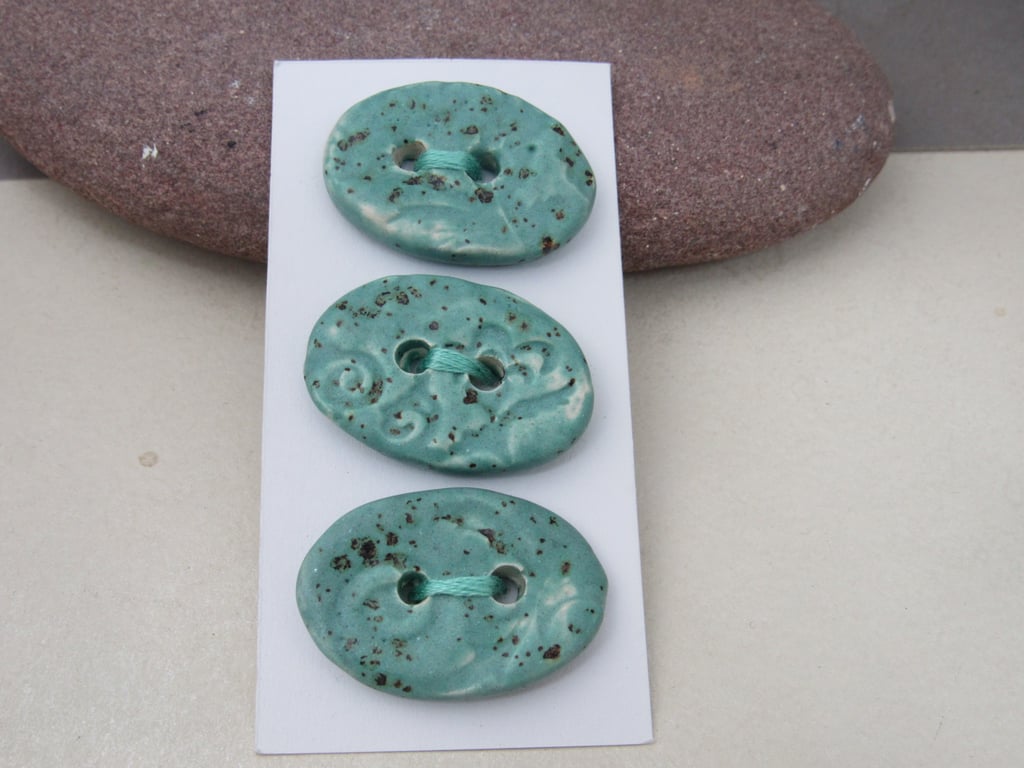 3 Medium Oval Eggshell Blue Brocade Pattern Ceramic Buttons