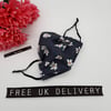 Face mask,  3 layer,  machine washable in navy floral fabric.  