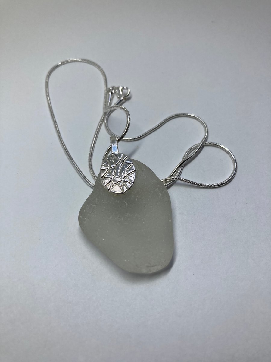 White seaglass drop on a silver plated 18 inch snake chain