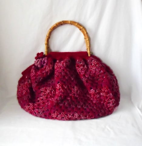 one of a kind lined crocheted granny bag with bamboo handles in maroon.