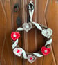 Scandi-style Christmas wreath with crocheted hearts and ribbon - Image 5