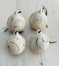 Set of four black and white swirled pebble baubles.  - Image 2