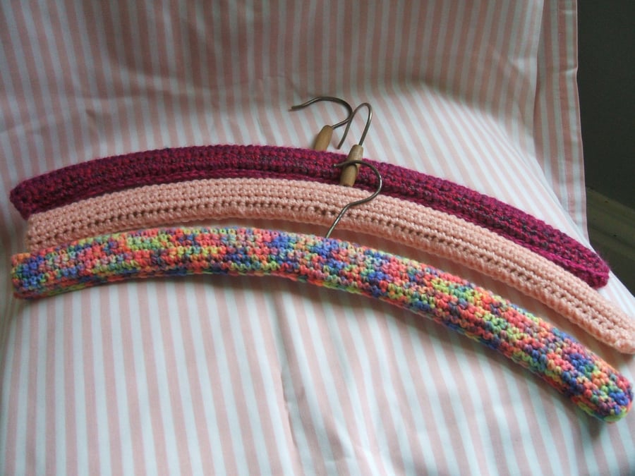 3 vintage coat hangers with new crocheted covers - pinks