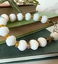 Glass bead bracelet in crisp white vintage beads with extension chain - Image 5