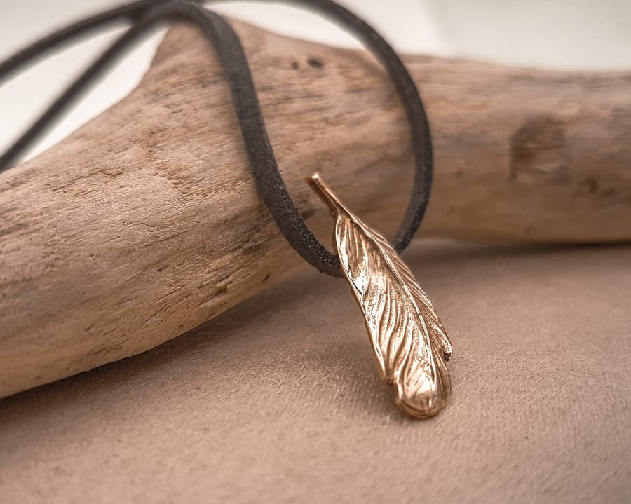 Small solid bronze feather and faux suede necklace