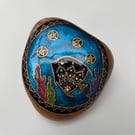 Hand painted fish on natural rock