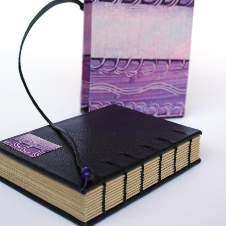 travel journal in slipcase, paste paper purple swirls