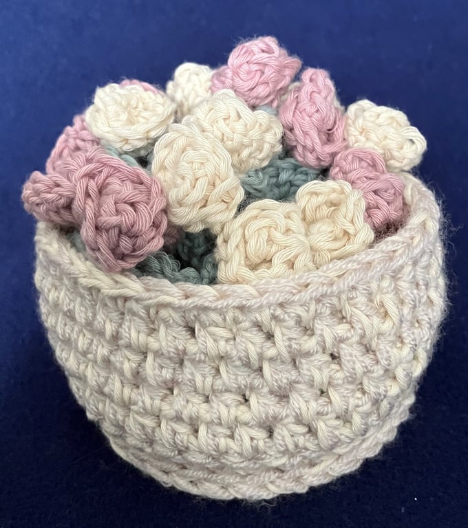 Set of four Rose flower drinking glass or mug coasters in a cream basket