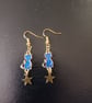 Gold and dark blue celestial cat and star dangle earrings 
