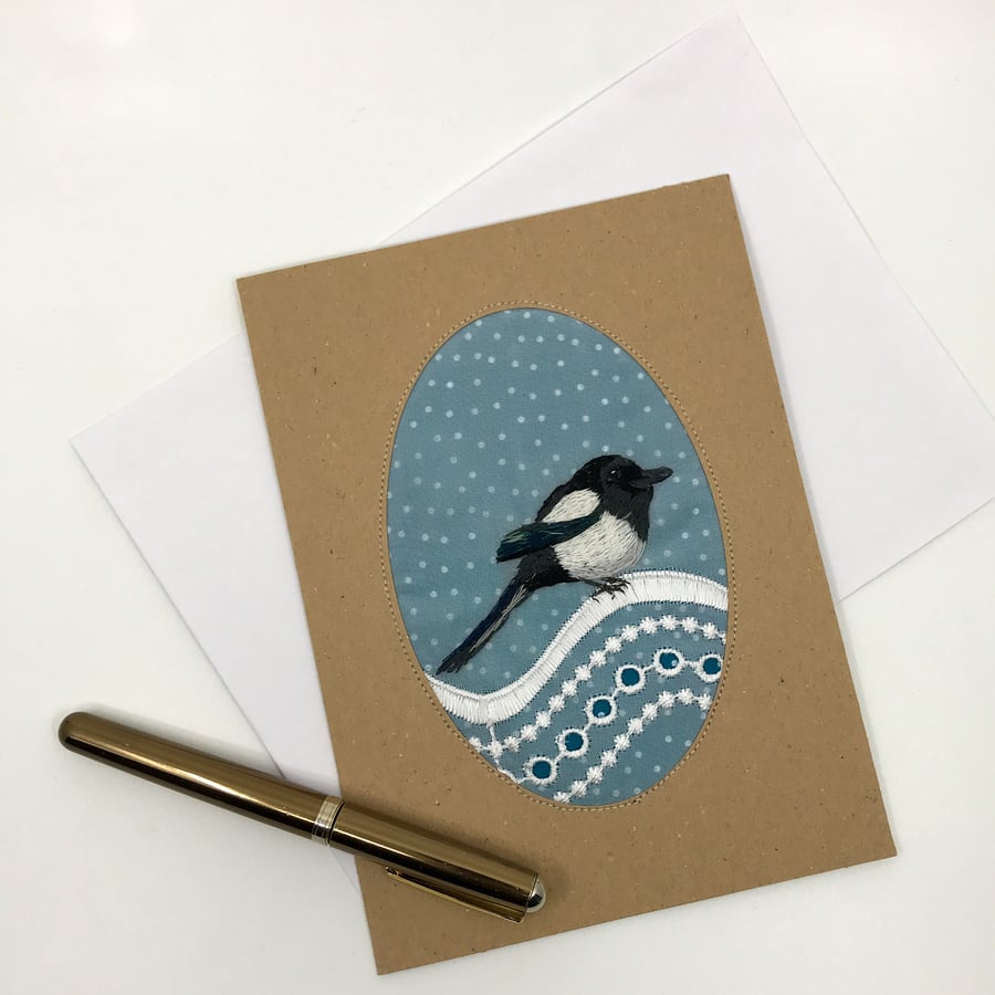 Blank greetings card with hand embroidered magpie