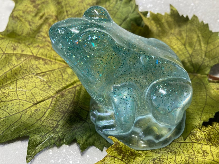 Resin Beautiful Pale Blue Frog sitting on a mirrored light.