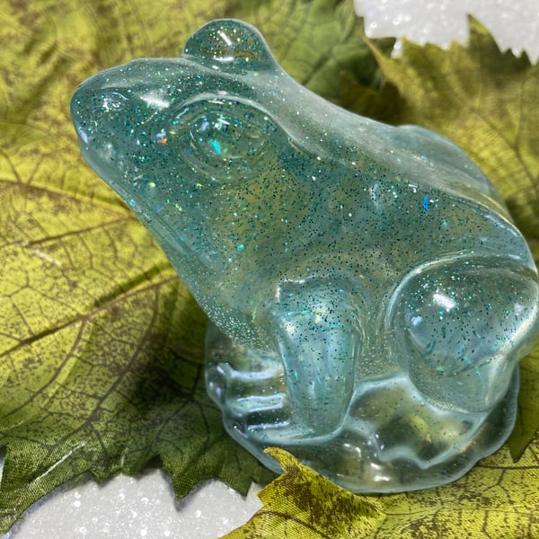 Resin Beautiful Pale Blue Frog sitting on a mirrored light.