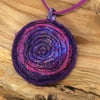Embroidered sparkly purple spiral textile necklace or pendant. 