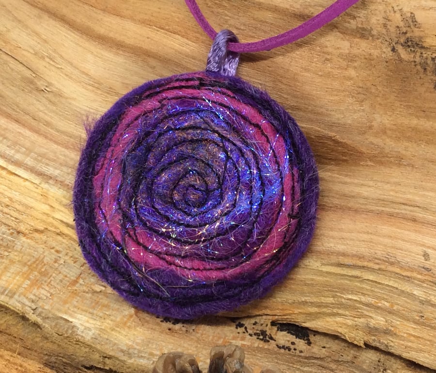 Embroidered sparkly purple spiral textile necklace or pendant. 