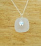 White sea glass pendant with silver heart charm - Image 3