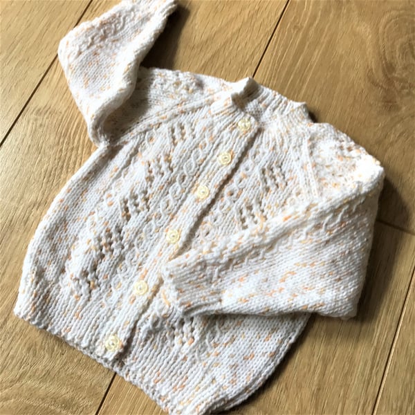 Hand knitted baby girl's cardigan to fit up to 9 months with lace and cable patt