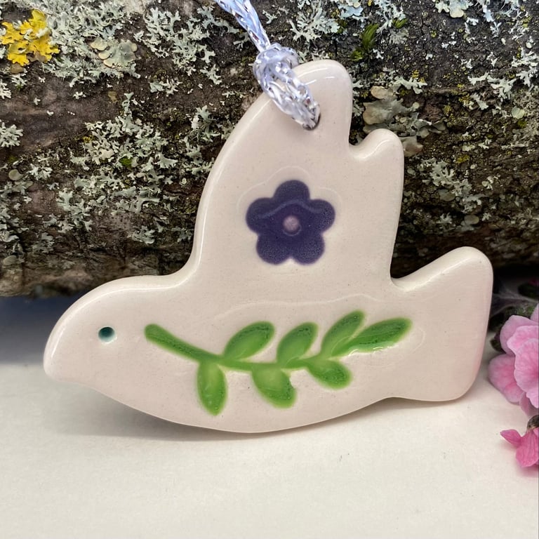 Teeny ceramic dove decoration with leaves and purple flower