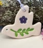 Teeny ceramic dove decoration with leaves and purple flower
