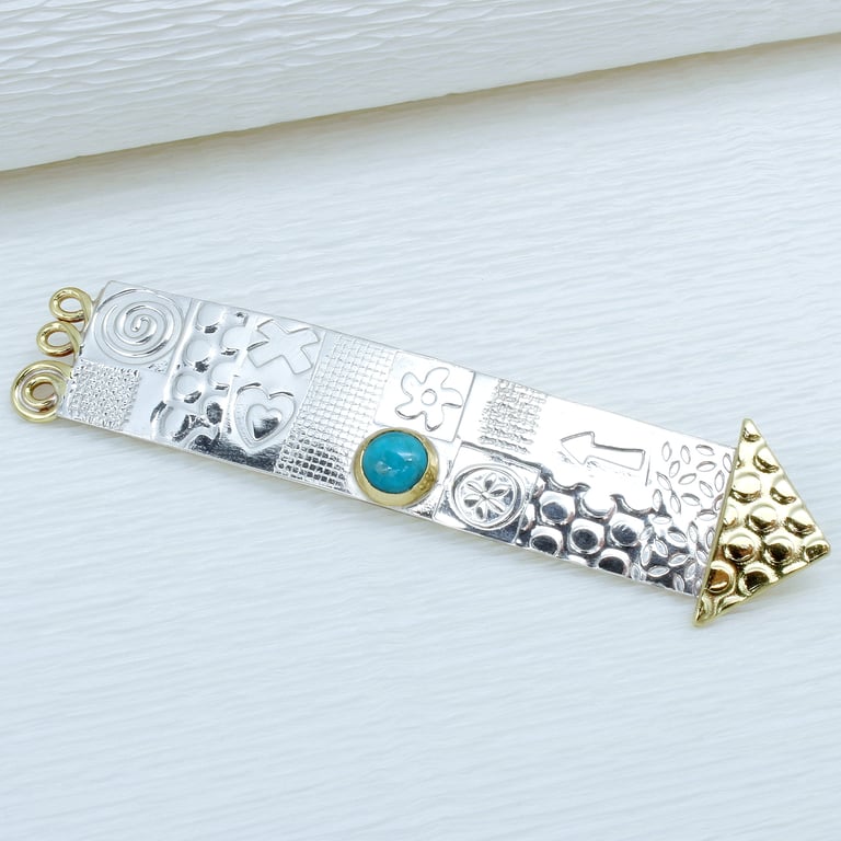 Handmade long sterling silver brooch, arrow shape with a Turquoise stone. 