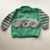 Hand knitted jumper with a fluffy dog design