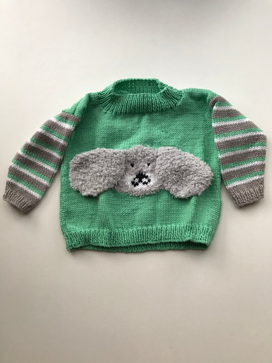Hand knitted jumper with a fluffy dog design
