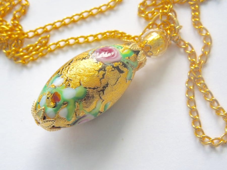 Gold decorated Murano glass oval pendant with gold chain,