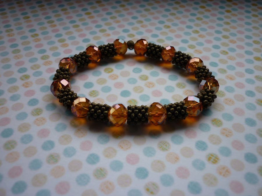 COPPER PINK AB CRYSTALS AND ANTIQUE BRONZE BRACELET.