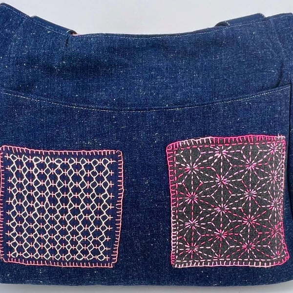 Handmade denim fully lined hobo bag with pockets and pink hand sewn Sashiko patc