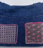 Handmade denim fully lined hobo bag with pockets and pink hand sewn Sashiko patc