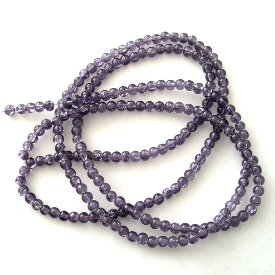 Long String of Purple Glass Crackle Beads