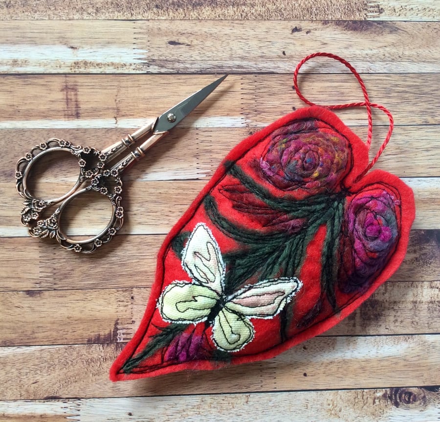 Handmade leaf with butterfly felting wool and machine embroidered decoration. 