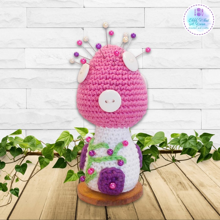 Crochet pink toadstool fairy house decoration, ornament or pin cushion.