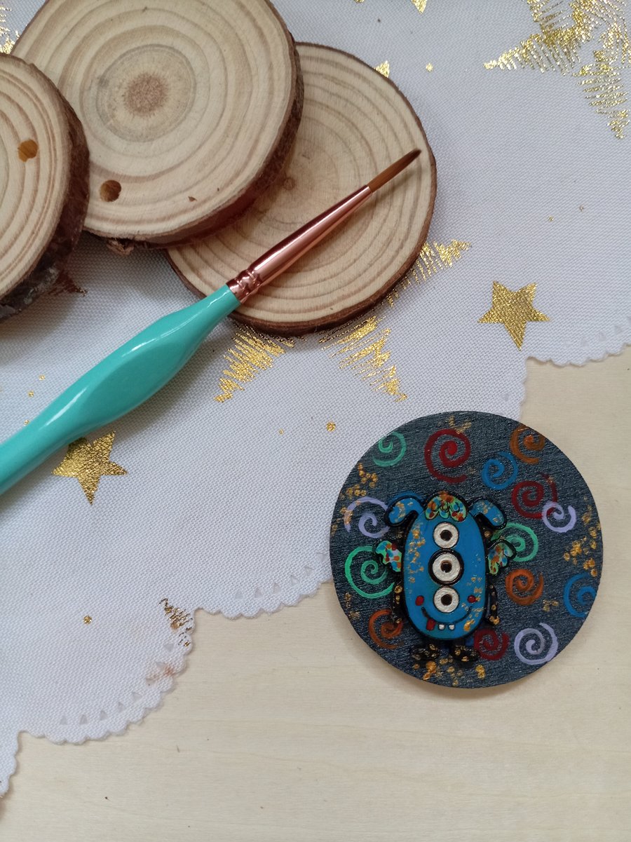 Wooden circular blue monster fridge magnet 