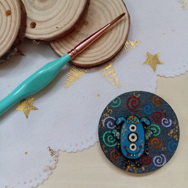 Wooden circular blue monster fridge magnet 