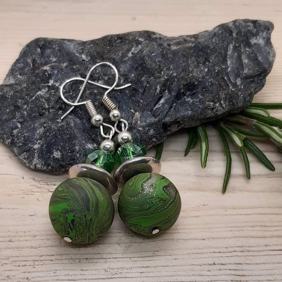 Green, black and silver dangly earrings