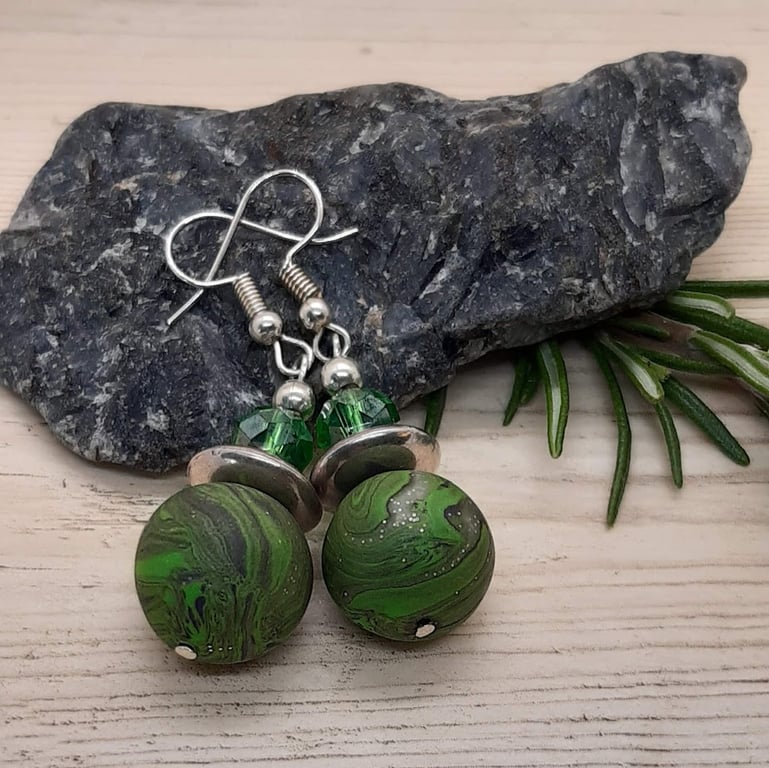Green, black and silver dangly earrings