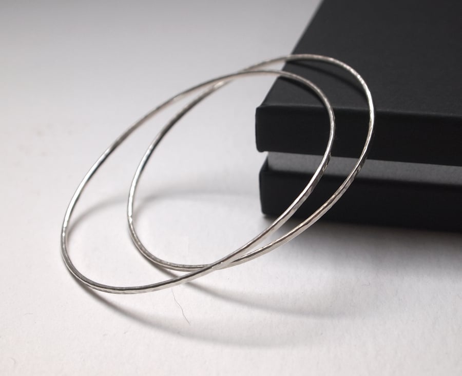 One skinny sterling silver bangle with hammered texture 
