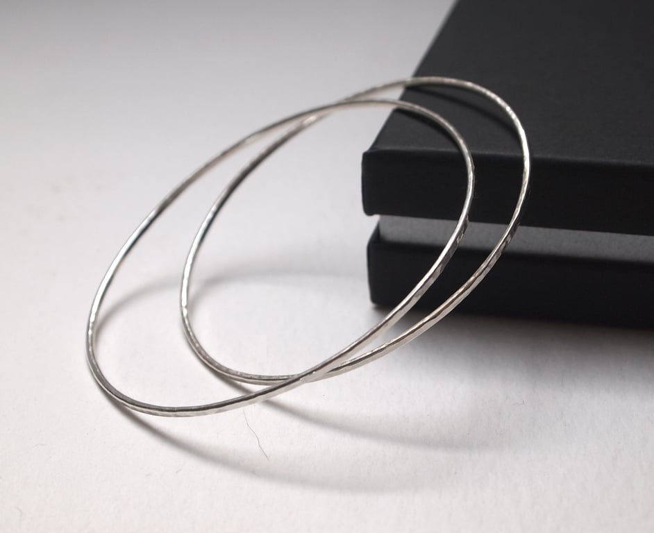 One skinny sterling silver bangle with hammered texture 