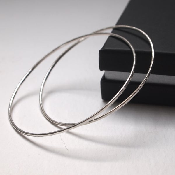 One skinny sterling silver bangle with hammered texture 
