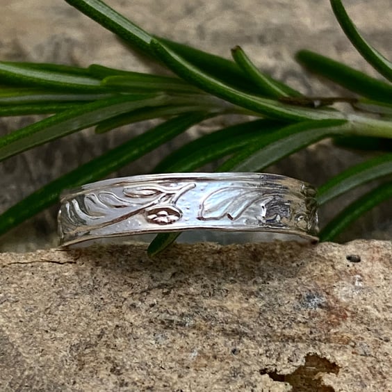 Silver ring ,  Traditionally Patterned Sterling size Q.